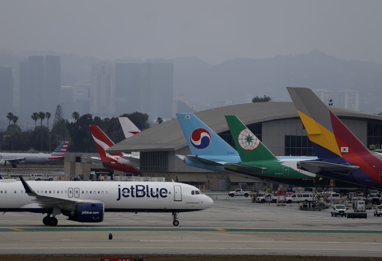 Flight cuts are spreading as fuel costs surge — and higher summer fares look likely