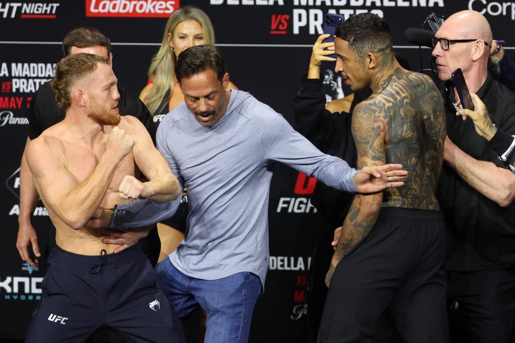 Carlos Prates held back as he tries to get at Jack Della Maddalena in heated face off: ‘Why you scared?’