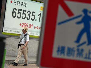 Asian shares are mixed as Brent crude approaches $100 a barrel